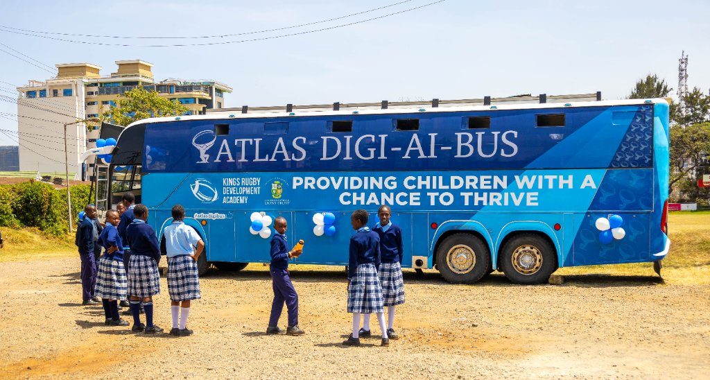 Secondary school pupils in uniform arriving at the Atlas Digi-AI Bus in Kenya
